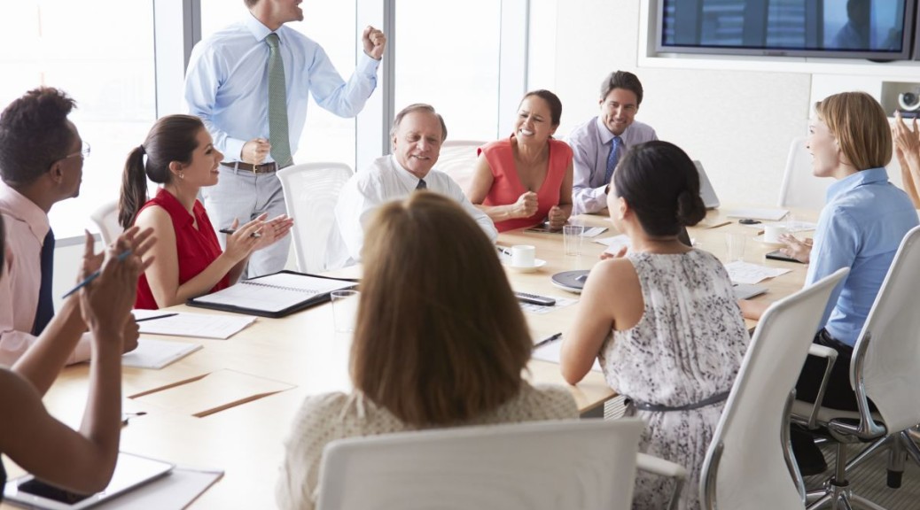 Man Leading an Enthusiastic Business Meeting